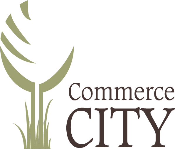 Commerce City logo with stylized green tree and grass design